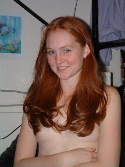 Cute amateur redhead with small breasts and pretty hair.
