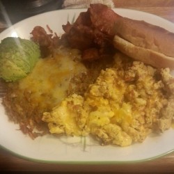 #Breakfast in bed for #misfitprincess. #Chipotle #tomato &amp; #cheese scrambled #eggs/#huevos, #bacon, #homemade #hashbrowns, sliced #avocado and a #toasted bun with #butter. Cause my baby don&rsquo;t do #biscuits #foodporn