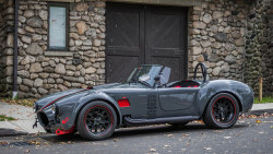 automotivated:  Grigio/Red Shelby Cobra by Faris Fetyani on Flickr.