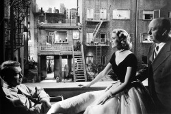 20th-century-man:  James Stewart, Grace Kelly, Alfred Hitchcock / production still from Mr. Hitchcock’s Rear Window (1954) 