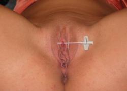 Clit pierced, ready for a ring.