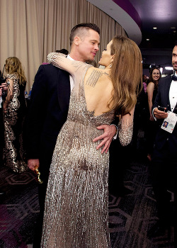 delevingned-deactivated20151023:  Brad Pitt and Angelina Jolie share an intimate moment backstage at the 86th Annual Academy Awards 