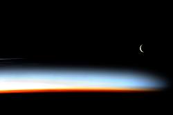 spaceexp:  Stunning sunset with crescent Moon from the ISS, photographed by cosmonaut Pavel Vinogradov 