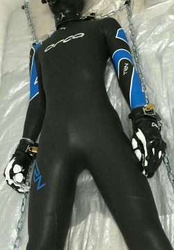 a-sum-a:  Asuma is in a wetsuit, motorcycle boots ,gloves and neoprene hooded gasmask. Chained to the bed with leather restraints for 2hours.  It’s hard to breath because the inlet hole is very small, but there is no way out! 