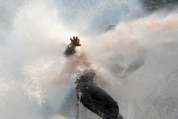 inothernews:  BLOWBACK  Police fired water at a protester during clashes in Istanbul’s Taksim Square Tuesday. Riot police used tear gas and water cannon to clear the area of protestors as prime minister Recep Tayyip Erdogan struggled to address widespread