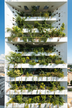 archatlas:  White Walls Jean Nouvel + Takis Sophocleous Architects From the architect: On the south façade a vertical landscape covers approximately 80% of the building’s façade area. This exceptional living environment is working like a natural