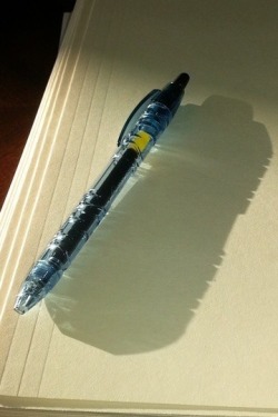 ottorail:  Pen made of recycled water bottles casts a shadow of a water bottle.