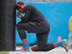 sportingnewsarchive:  Carolina Panthers’ Cam Newton pauses at a goal post before warming up before an NFL football game against the New Orleans Saints in Charlotte, N.C., Sunday, Dec. 22, 2013. (AP Photo/Bob Leverone) 