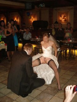 public-flash:  Sexy bride nude photo flashing her pussy at the wedding party.