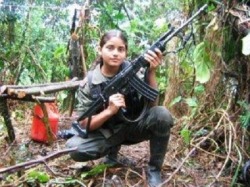 gunrunnerhell:  It’s a hard knock life… A young girl poses with her Galil rifle. She is a member of the FARC, an extremist revolutionary guerrilla group operating in South America. They are known for having child soldiers; male and female. The female