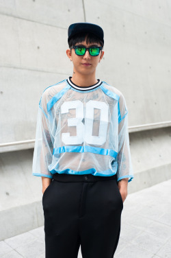 wgsn:  Sheer varsity top over tattoo for the best personalisation of the sports casual trend, photo by @studiolumiere 