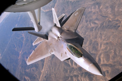 flying-fortress:  A U.S. Air Force F-22 Raptor backs away from a KC-135 Stratotanker aircraft during a refueling mission over New Mexico, Oct. 23, 2013.