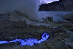 coolthingoftheday:  Indonesia’s Kawah Ijen is a volcano near East Java that erupts blue lava from its crater. The volcano spews sulphuric gases into the air, which is set ablaze by the heat of the magma, making it appear blue.  I&rsquo;ve been here