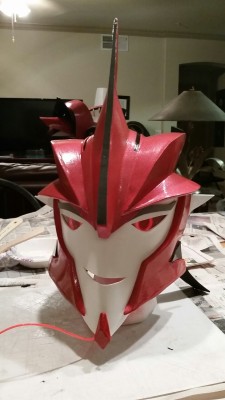 ask-dr-knockout:  The Knockout Costume Helm complete! El wire optics inset in the helm to allow for eye tracking simulation. There are 2 levels of plastic covering, and outer clear layer and an inner red transparent layer to provide the tint on top of