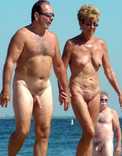 mixedgendernudity:  Mature couple walking around at the nude beach