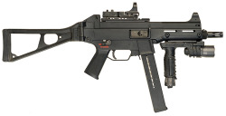 war-tools:  Heckler &amp; Koch UMP45 - .45 ACP fitted with a C-More red dot sight and Surefire M900 weaponlight foregrip