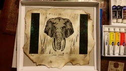 Printmaking papr burned with lighter, Printmaking from linoleum block of elephant head, then watercolor paint to give it a little extra detail with color,it&rsquo;s a gift for my grandmother!!!!