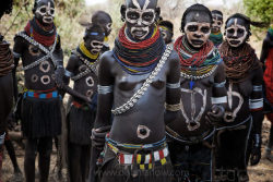   Ethiopia’s Omo Valley, by Olson and Farlow    These Nyangatom women paint themselves to celebrate a peace agreement just initiated with the Karo tribe across the river.  Last year these two tribes were killing each other over control of fertile Omo