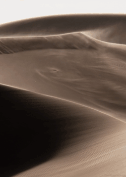 poetryslutsunited:  romancelovelust:  Just two among billions. Souls piled high into vast fields, endless dunes,  mountains of stultifying sameness. Each grain almost identical to the other. Almost.  Somehow, we two specks of dust conceived the existence,