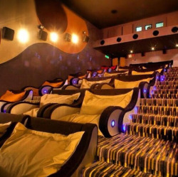 lotsalipstick:  enchantingsnow:  brooklyn-bridge:  A movie theatre you can cuddle in  or if you’re me and forever alone, a movie theatre where i can spread out and have a couch to myself and my food.  I mean, I’ll take either option 