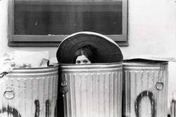  Carrie Fisher hiding in the trash cans on the backlot of the Star Wars set. 