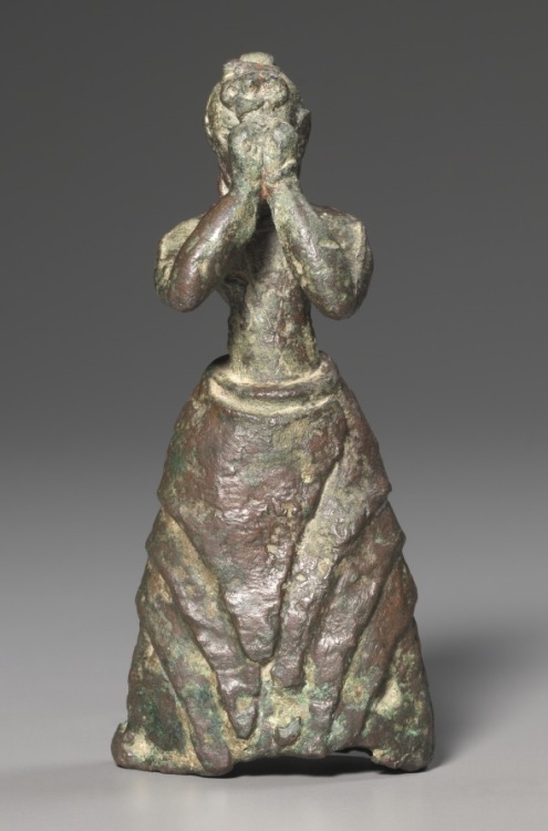 cma-greek-roman-art:  Female Worshiper, c. 1600-1500 BC, Cleveland Museum of Art: Greek and Roman ArtThis extremely rare Minoan bronze statuette represents a girl worshiping a deity. It was probably left as a dedication to a divinity. She wears a flounced