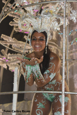 Naked and body painted at a Brazilian carnival, by Carlos Ricon.