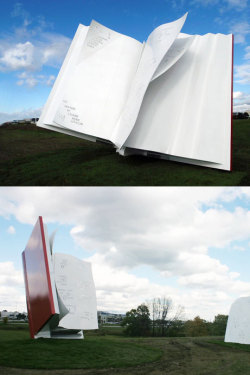 booksbooksbooks:  aquabooks:  The Book, located near Toronto’s Pearson Airport. Artist Ilan Sandler says: The Book is a steel sculpture with two pages torn away from its spine. The spine is perpendicular to the ground, the covers are open, and the pages