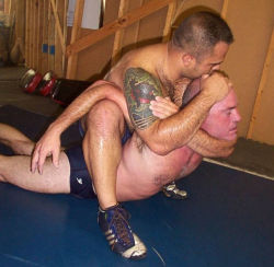 wrestle-me:  Two sweaty wrestlers tangled in what looks like a fun match.  Get Your Wrestling Singlet