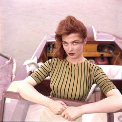 grapnel:  Tina Louise in a motor boat.