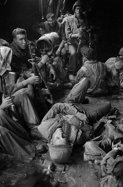 vietnamwarera:  American soldiers rest in a boat as they are transported through the Mekong Delta back to their base. (Photo taken by Henri Huet)