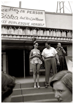 Vintage 50&rsquo;s-era candid photo captures a pair of teenage girls taking in the spiel of a Carnival barker.. An unidentified showgirl presents herself on the Bally stage of a girlie-show headlined by &ldquo;Miss Burlesque Herself&rdquo;: Siska..