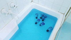 unofficialdragon:  lesprisenpati:  aidenmorse:  Bottles of Gatorade Blue Bolt floating in a bath of Powerade Mountain Blast, 2013  I can’t tell if this is seriously art or if it’s just tongue in cheek sarcastic art or if it’s post-ironic ironic