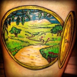 fuckyeahtattoos:  My new precious tattoo! A Lord of the rings/Hobbit hole doorway. Done by Ian at Area 51 Tattoos in Cedar Falls, IA. www.area51tattoos.com 