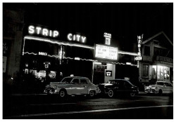 STRIPTEASE BOOM! Vintage press photo dated from April of ‘51, features the neon-lit facade of the &lsquo;STRIP CITY&rsquo; nightclub; located on Western Avenue (at Pico), in Los Angeles.. The photo accompanied a news story about the proliferation of
