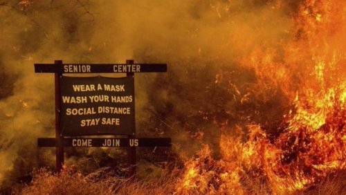 adamthegirl:  california wildfires surrounding coronavirus protocols sign. 2020 in an image. photo by noah berger 
