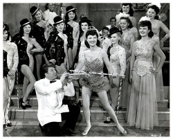 Ann Corio appears as dancer &ldquo;Dixie Barlow&rdquo; in a publicity still from the 1943 film: &ldquo;SARONG GIRL&rdquo;; produced and released by &lsquo;Monogram Pictures&rsquo;..  The film&rsquo;s cast also included actress Irene Ryan, who would achiev