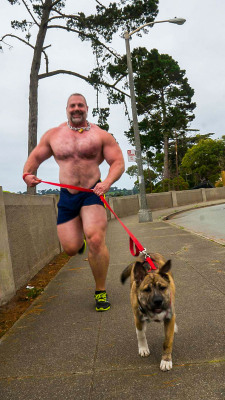 noodlesandbeef:  Alpha has been jogging with Thor while I’ve been away…shirtless, apparently.Can you just imagine this beefcake running around your neighborhood?  Pecs bouncing, package swaying, the jingle of his collar letting you know he’s coming