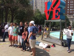 shortasscorporal:  thebluelip-blondie:  thesoftghetto:  ladyluna13:  ras-al-ghul-is-dead:  A silent protest in Love Park, downtown Philadelphia orchestrated by performance artists protesting the murder of Michael Brown in Ferguson. The onslaught of passer