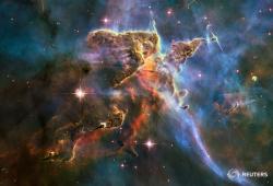 reuters:  This NASA Hubble Space Telescope image captures the tempestuous stellar nursery called the Carina Nebula, located 7,500 light-years away from Earth in the southern constellation Carina. This image celebrates the 20th anniversary of Hubble’s
