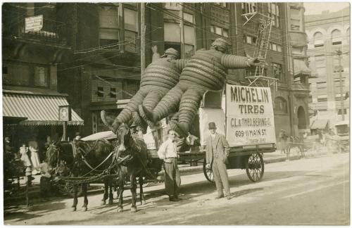 blondebrainpower:  Two Michelin Men riding a horse-drawn cart through the streets of Houston, Texas, c.1904