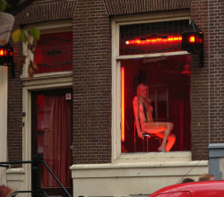travelsexguide:  Red lantern and a chick in right micro lingerie. It’s a cold day in Amsterdam. 
