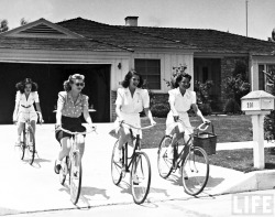 girlsandmachines:  Peter Stackpole -  Rita Hayworth trying out some new tricks on her bicycle during 10-mile trip w. friends through the hills, Westwood, 1940.