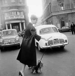 vintagegal:  Audrey Hepburn and her dog Mr. Famous leave the Hotel Hassler on the Piazza Trinita dei Monti, 1960 (via)