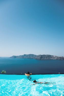 airemoderne:  InfinityLeisure seekers swimming in an infinity pool overlooking the Caldera at a boutique getaway in Santorini. Brought to you by Motivations For LifePhotographer: Ephraim MullerLocation: Santorini, GreeceWebsite | Facebook | Twitter |