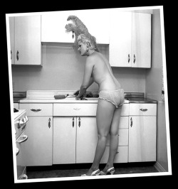 Brandy Jones likes to wear her showgirl headdress when she does the dishes..