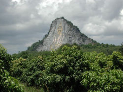 kelledia:  This cliff in Chonburi, south of Pattaya, Thailand, has a Buddha figure engraved in it, 130m tall and 70m wide and is inlaid with gold. It can be seen from miles away. 