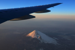 theantidote:  Flying (by Teruhide Tomori) View from an airplane flying by Mt.Fuji. Altitude about 8,000 metres 