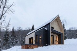 takeovertime:  Villa Boreale | Cargo ArchitectureA Scandinavian inspired Villa in Canada Contrasting dark timber with light tones of Eastern White Cedar. A warm house which offers comfort in the harsh surrounding areas.
