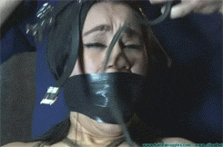 gagged4life:  A muzzle over a wraparound tape gag can be overkill, but the lines of a muzzle still connote “animal” better than most any other piece of bondage equipment. 